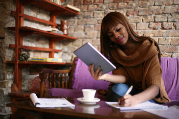 Woman writing in a notebook